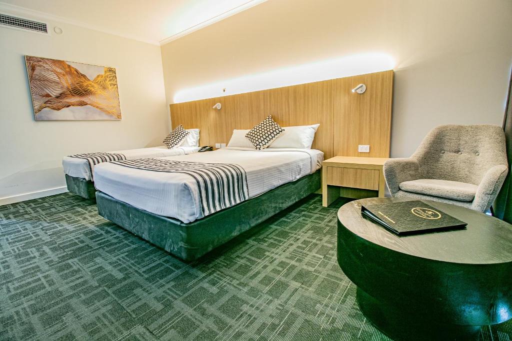 Voodi või voodid majutusasutuse Absolute Beachfront Opal Cove Resort toas