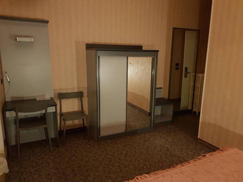 Postel nebo postele na pokoji v ubytování Hotel Ada