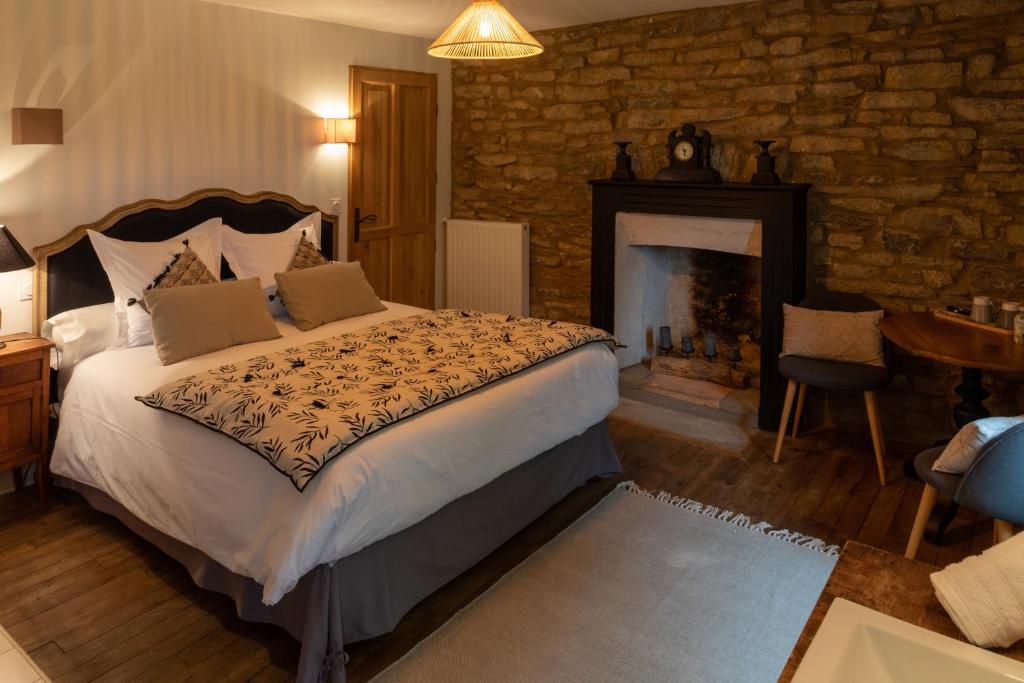 Postel nebo postele na pokoji v ubytování Domaine du Kelenn, Maison d'hôtes de charme avec piscine