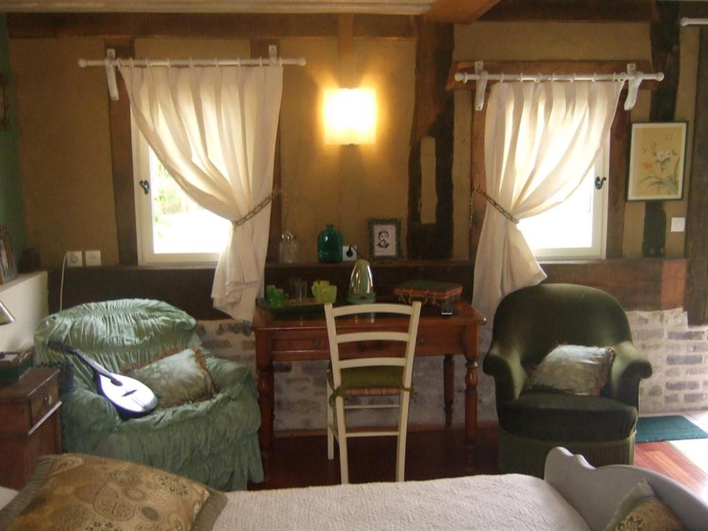 Posezení v ubytování Les Chambres de Pontfol - Chambres d'hôtes - Guest house