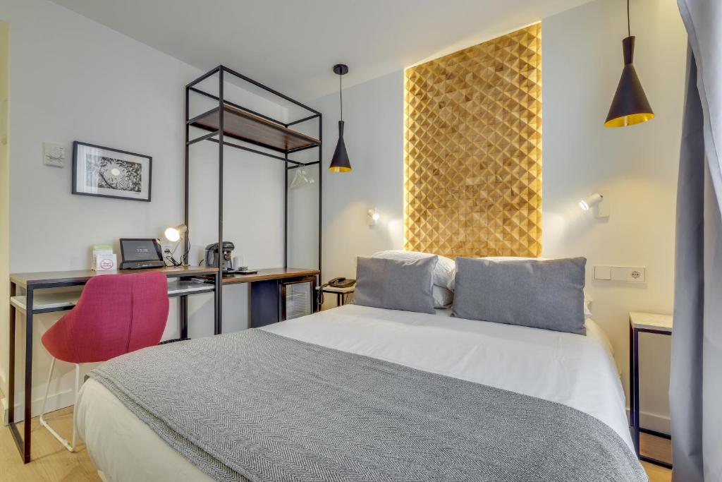 Ένα ή περισσότερα κρεβάτια σε δωμάτιο στο Hotel Beausejour