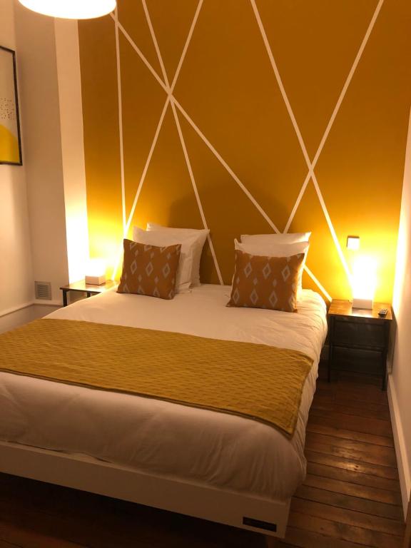 Postel nebo postele na pokoji v ubytování Ginkgo Maison d'hôtes
