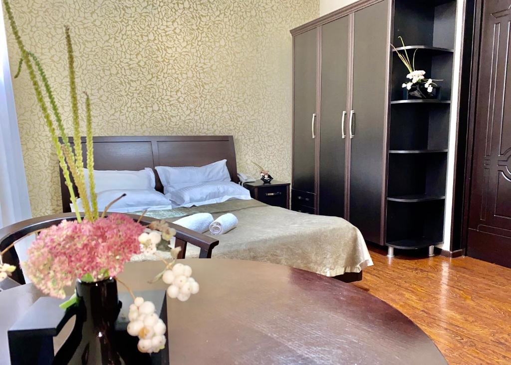 Postel nebo postele na pokoji v ubytování Parvana Hotel
