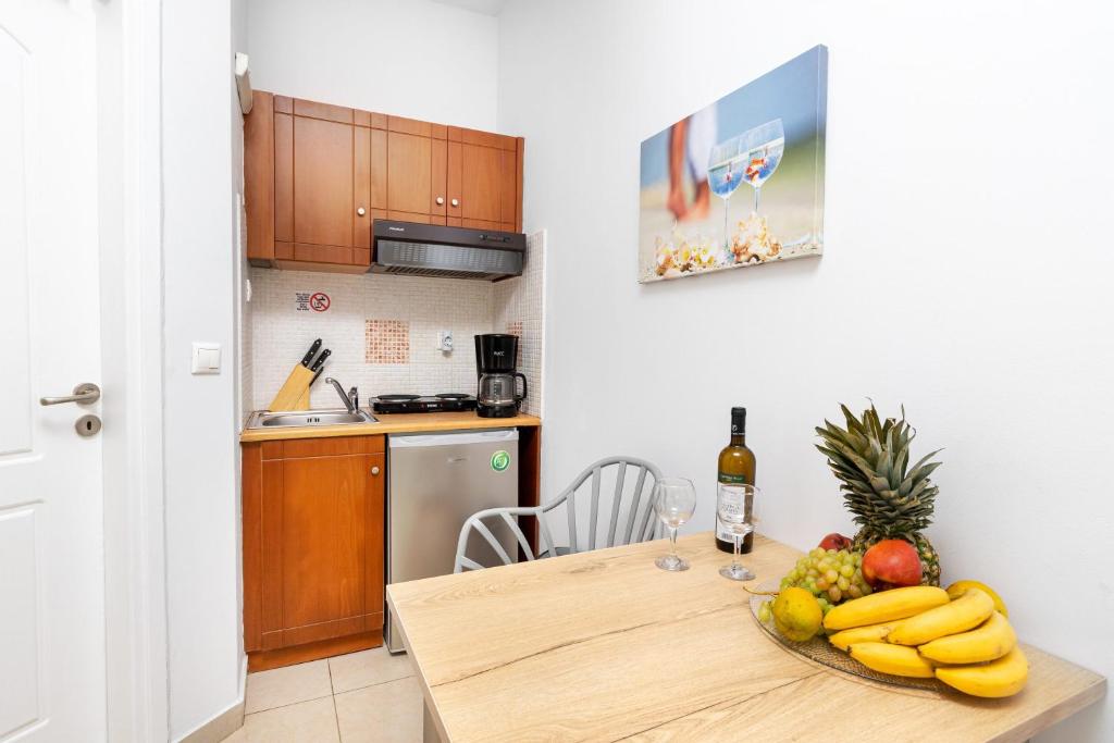 Kuchyň nebo kuchyňský kout v ubytování Sun Beach Apartments