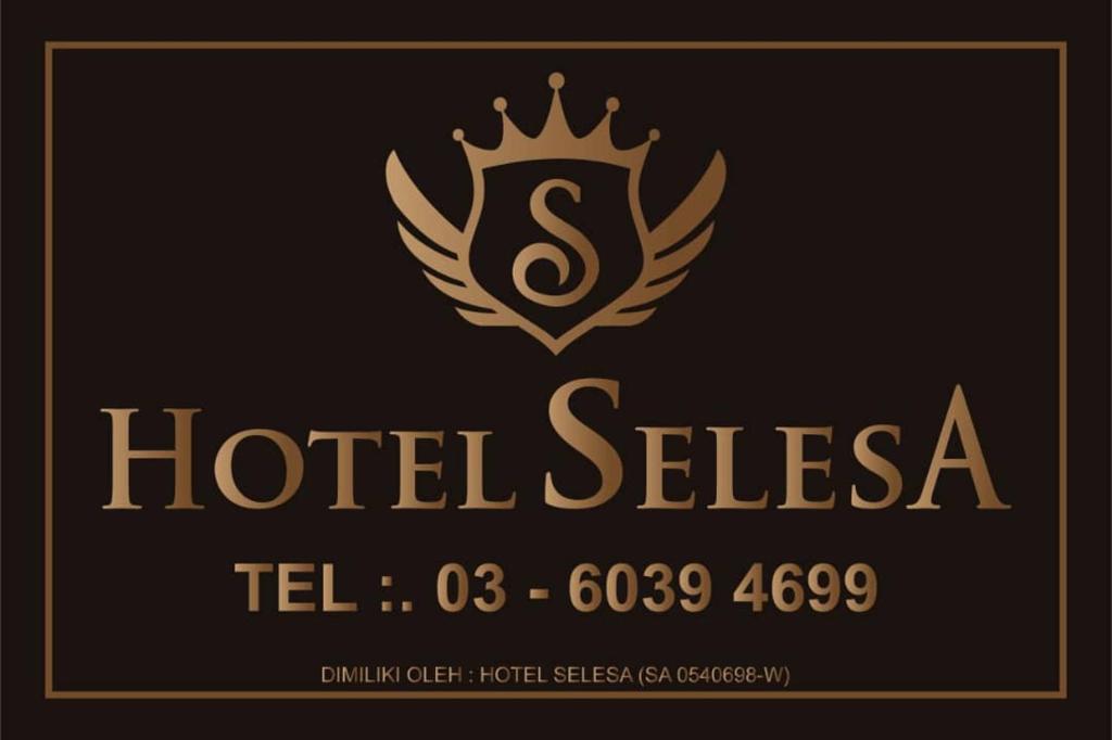 a logo for a hotel suite with a crown on it at Hotel Selesa in Sungai Buluh
