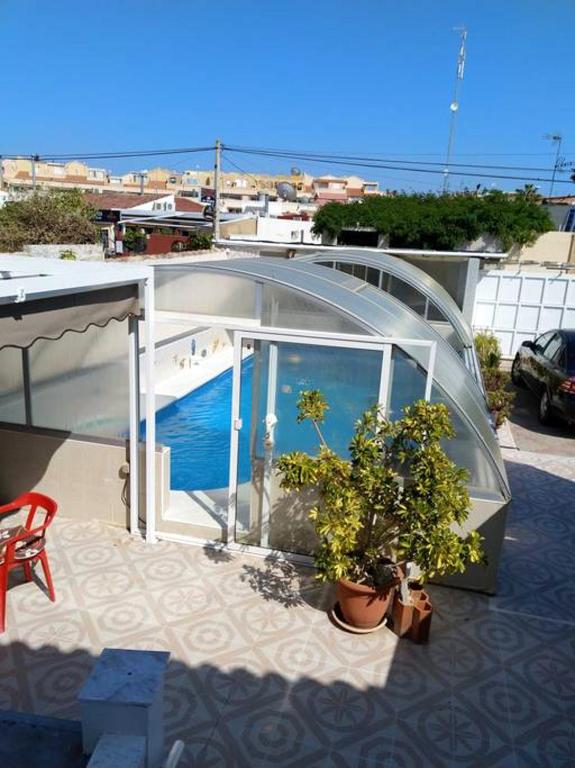 Bazén v ubytování Cozy apartment in El Chaparral, 60 m², shared pool nebo v jeho okolí