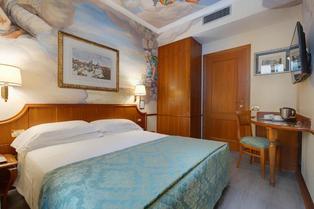 Postel nebo postele na pokoji v ubytování Hotel Amalfi