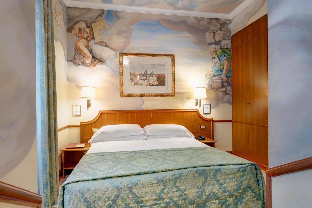 Postel nebo postele na pokoji v ubytování Hotel Amalfi