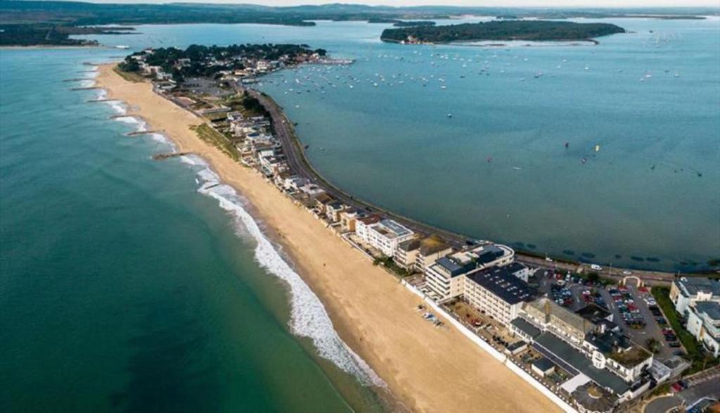 an aerial view of a beach and the ocean at Beautiful Apartment with a stunning location in Poole