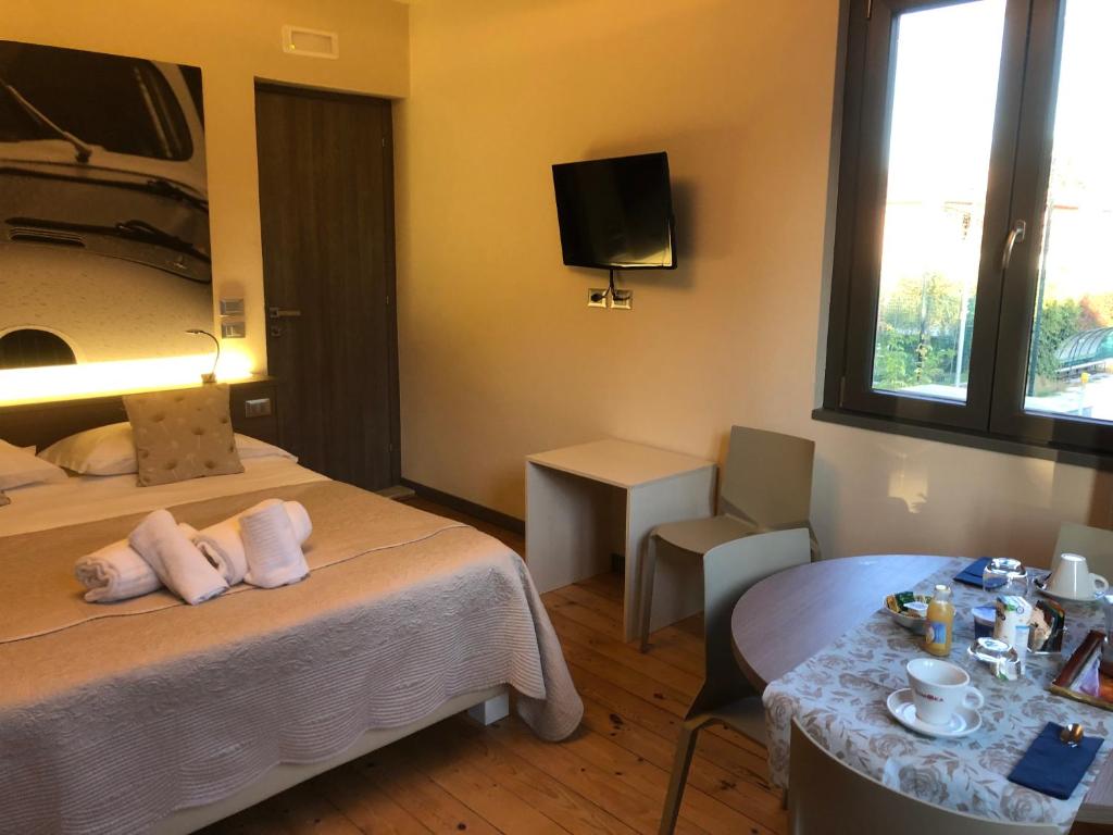 Posteľ alebo postele v izbe v ubytovaní International Rooms & Apartments