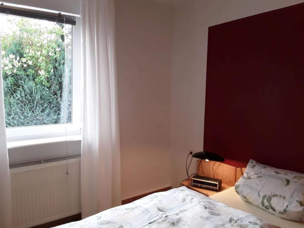 Katil atau katil-katil dalam bilik di Ferienwohnung am Rande Kassels