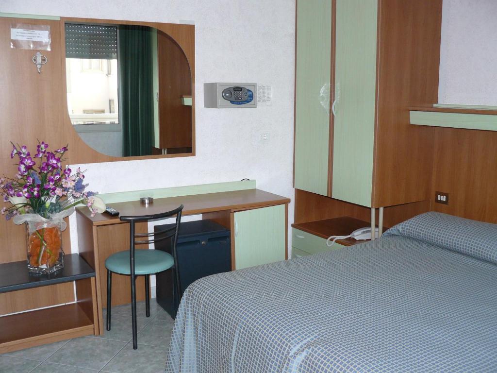 Postel nebo postele na pokoji v ubytování Hotel Baviera