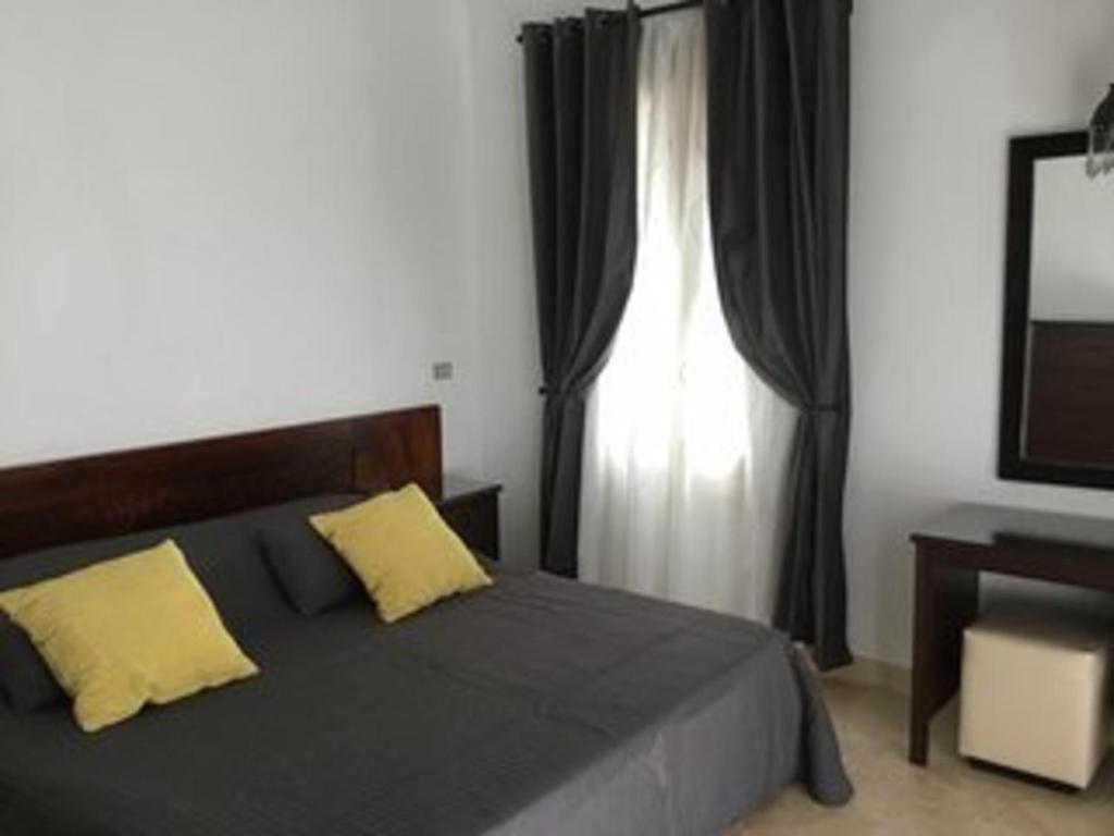 A bed or beds in a room at Extremely Private Villa with Optional Pool Heating
