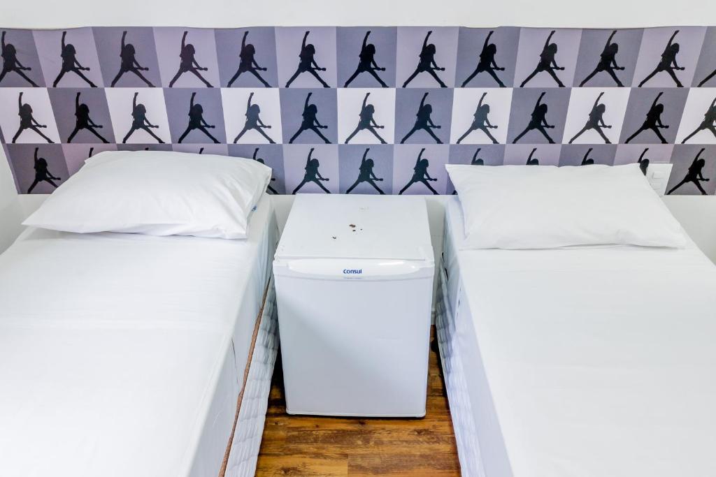 Postel nebo postele na pokoji v ubytování Rock CGH Suites - Aeroporto de Congonhas
