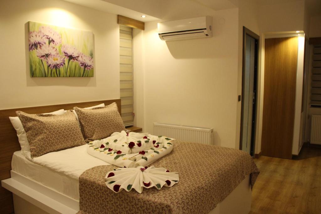 Кровать или кровати в номере Devin Otel