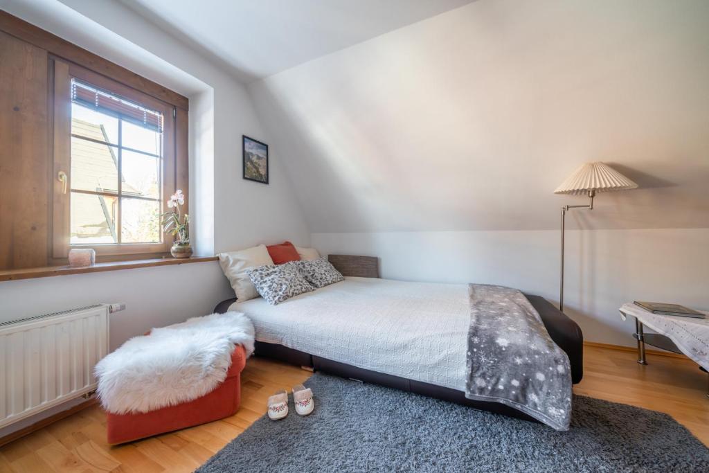 Postel nebo postele na pokoji v ubytování Apartamenty Tatrzańskie Turnie