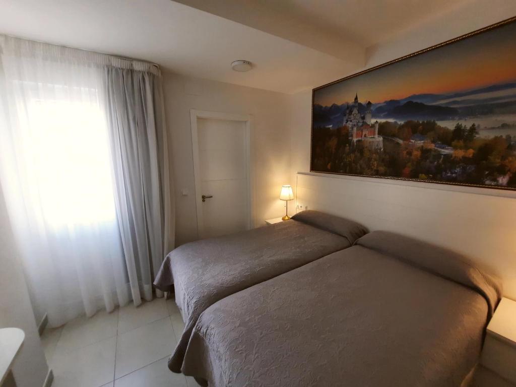 Кровать или кровати в номере Hotel Maravillas del Mundo