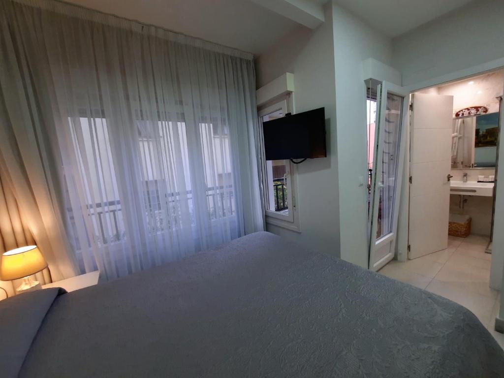 Кровать или кровати в номере Hotel Maravillas del Mundo