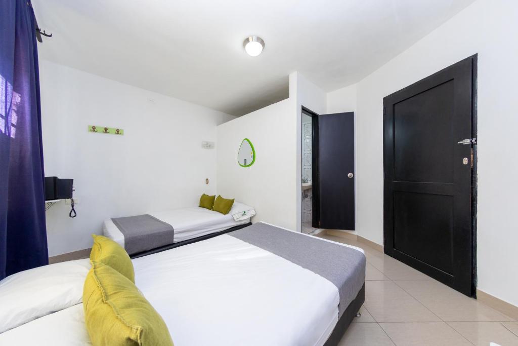 Postel nebo postele na pokoji v ubytování Ayenda 1231 Paradise Center