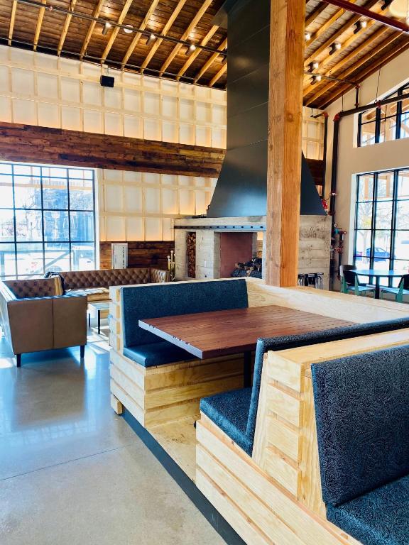 a dining room with a table and chairs at Cotton Court Hotel, by Valencia Hotel Collection in Lubbock