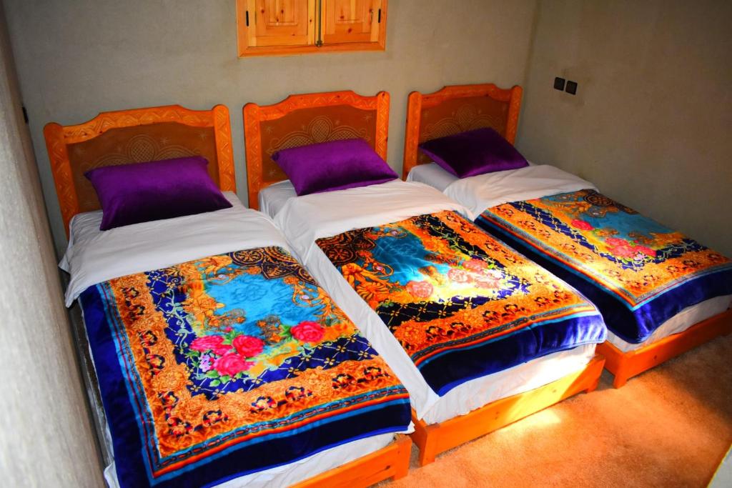 Postel nebo postele na pokoji v ubytování Dar Akiode Toubkal