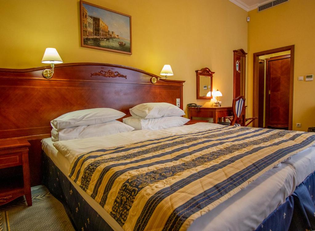Postel nebo postele na pokoji v ubytování Hotel Giovanni Giacomo