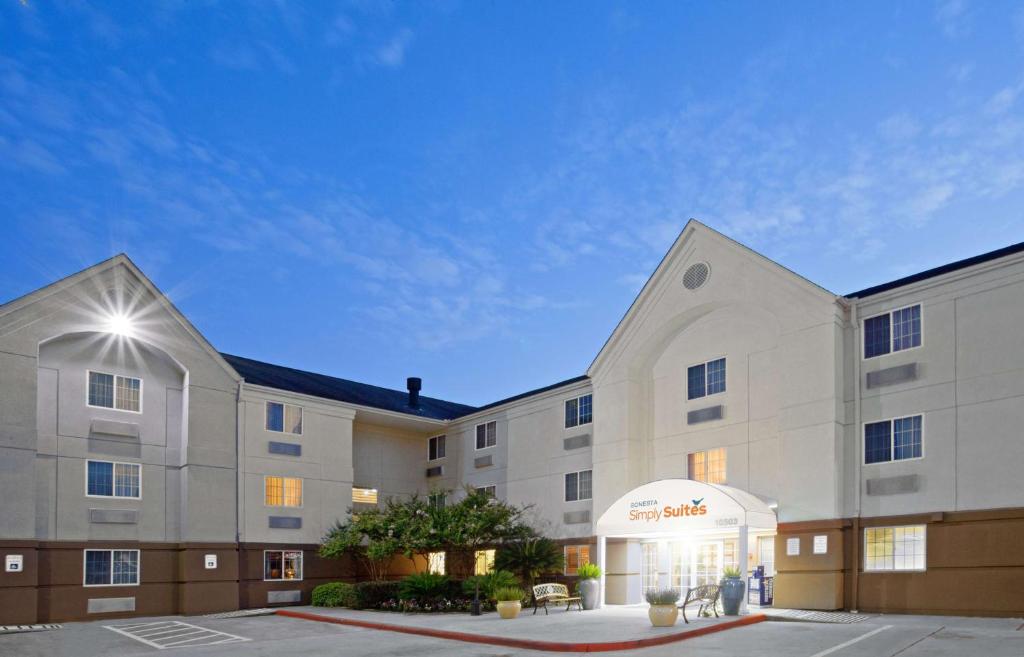 a rendering of a hotel with a building at Sonesta Simply Suites Houston CityCentre I-10 West in Houston