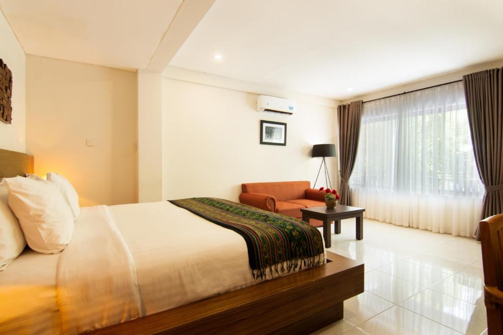 Een bed of bedden in een kamer bij Diva Lombok Resort