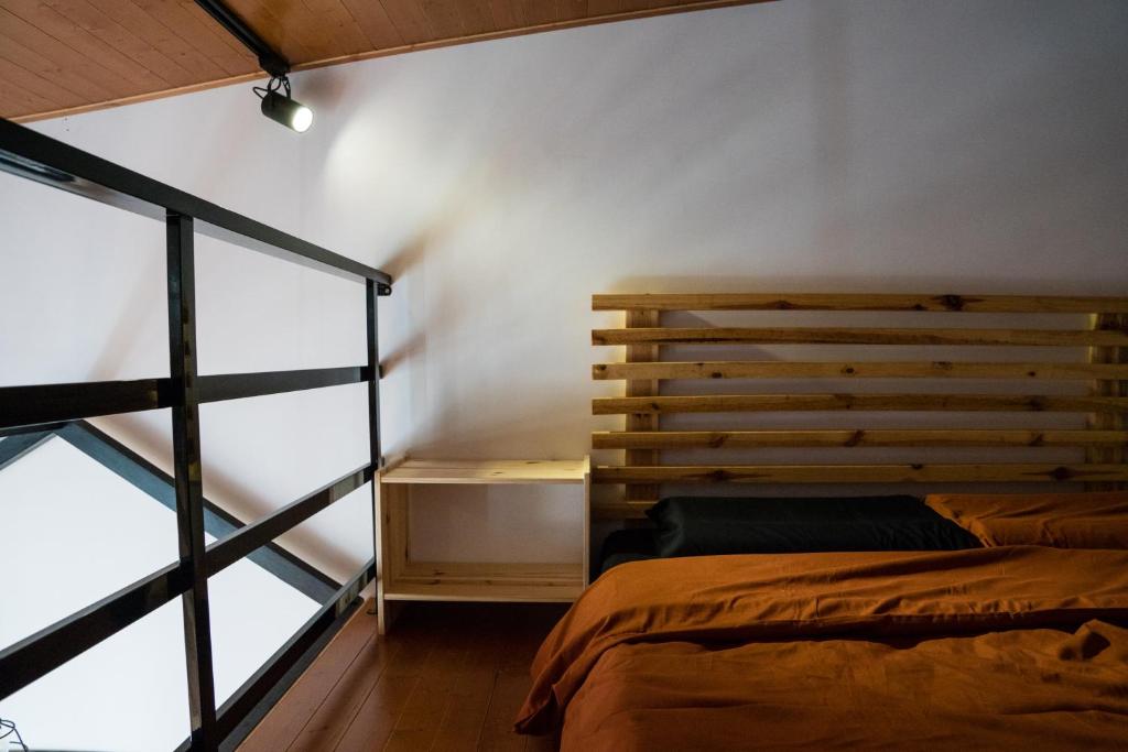 Postel nebo postele na pokoji v ubytování Hinoki Mansion