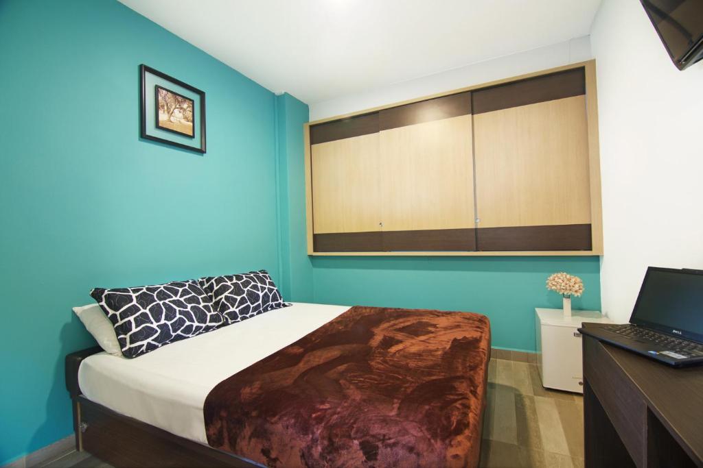 Voodi või voodid majutusasutuse Tai Hoe Hotel toas