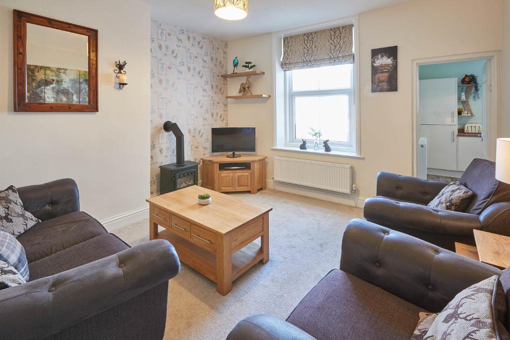 a living room with two couches and a television at Host & Stay - Church Square Eskape in Whitby