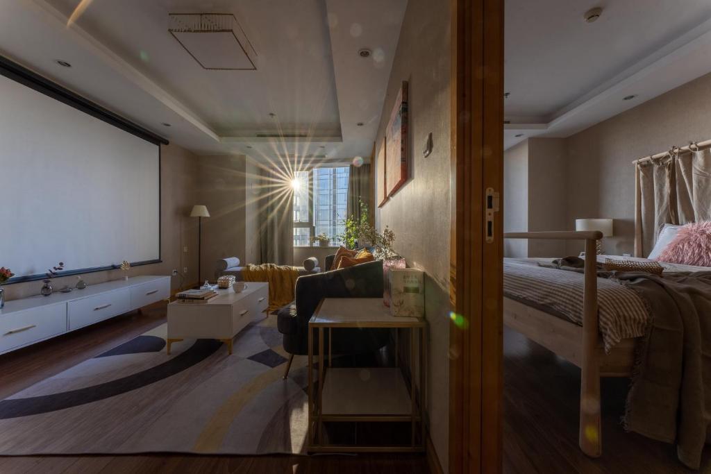 Postel nebo postele na pokoji v ubytování Tianjin G'apartment - Five Great Avenues