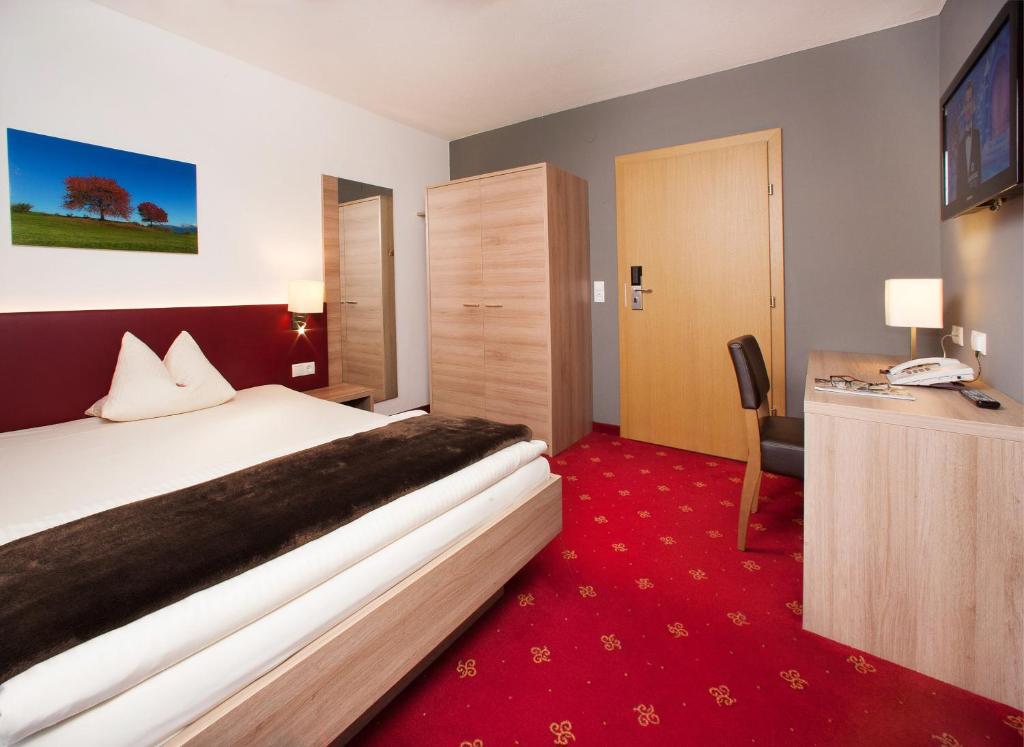 Postel nebo postele na pokoji v ubytování Hotel Bruno