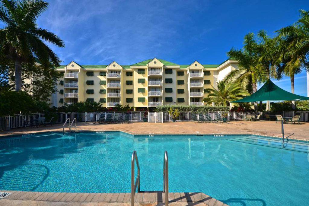 a swimming pool in front of a resort at Sunrise Suites - Sea Breeze Suite 101 in Key West