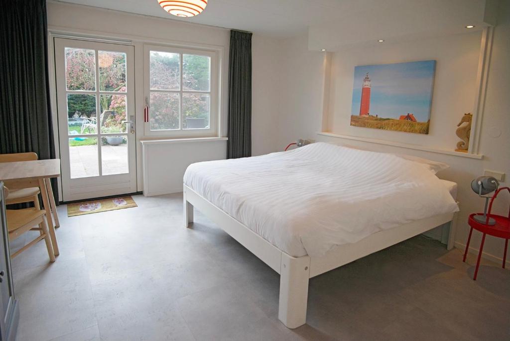 Postel nebo postele na pokoji v ubytování Bed & Bad Soet Texel