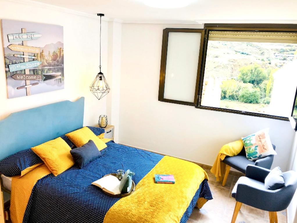 Ένα ή περισσότερα κρεβάτια σε δωμάτιο στο Charming House in Viguera with Mountain View