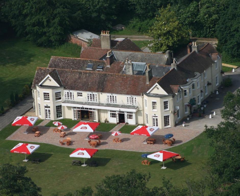 an aerial view of a house with umbrellas in front of it at Tyrrells Ford Hotel in Christchurch