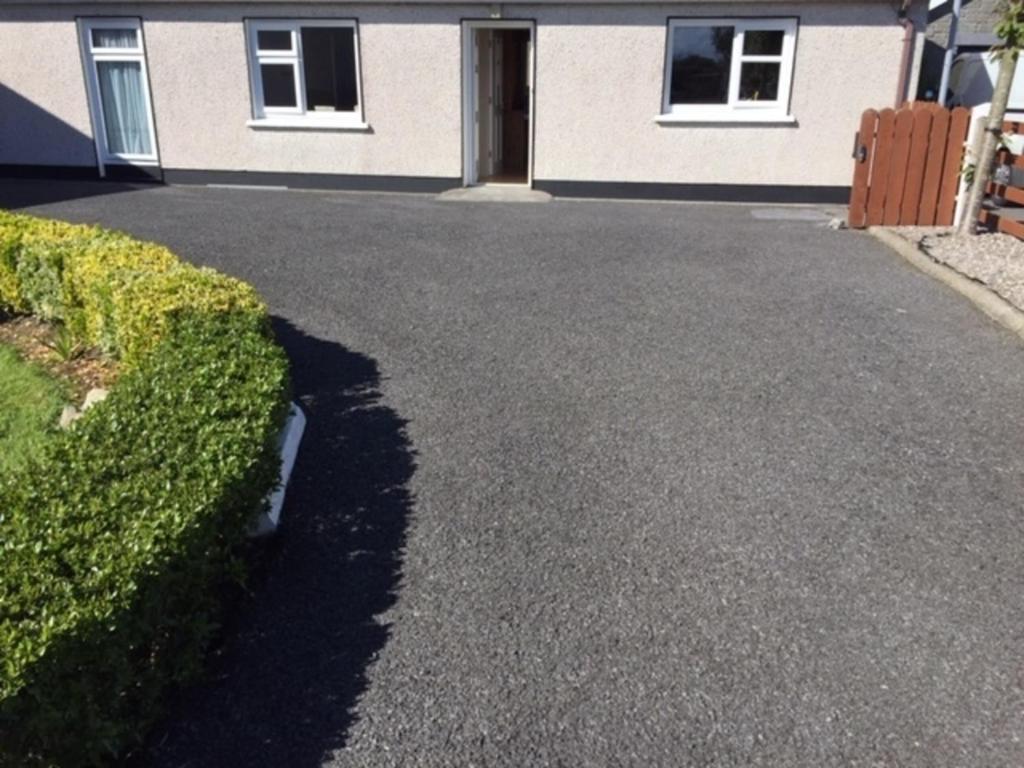a driveway in front of a house at Cosy 2-Bed Cottage in Sligo in Enniscrone