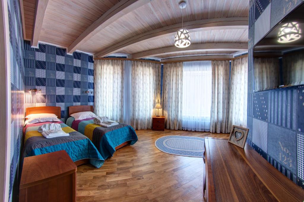 Postel nebo postele na pokoji v ubytování Olga Deluxe