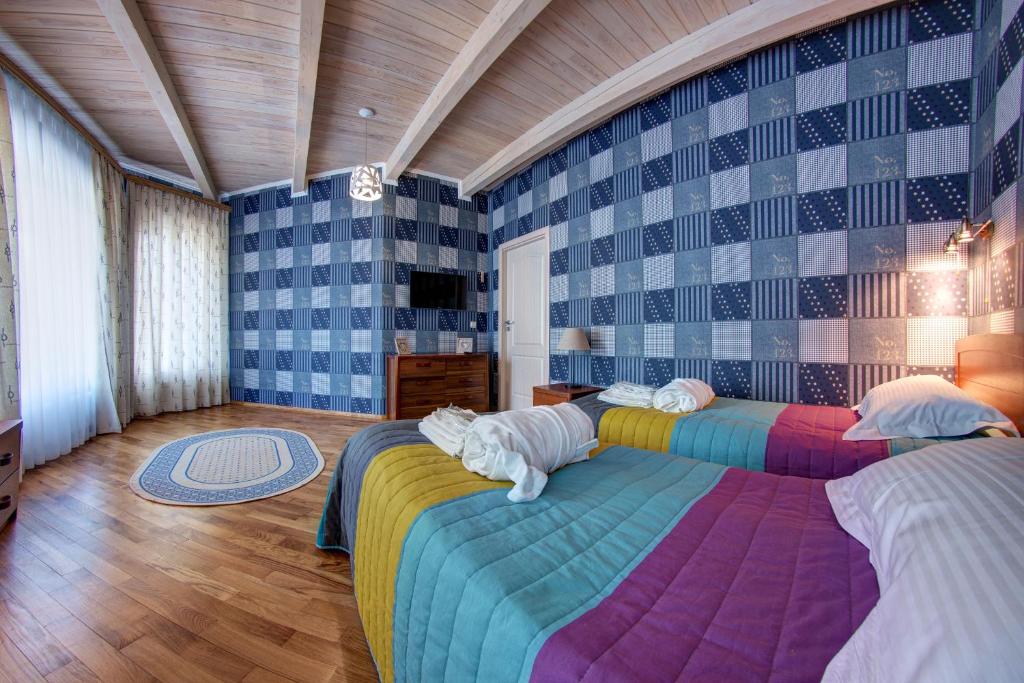 Postel nebo postele na pokoji v ubytování Olga Deluxe