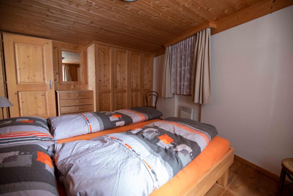 Postel nebo postele na pokoji v ubytování Alpensonne