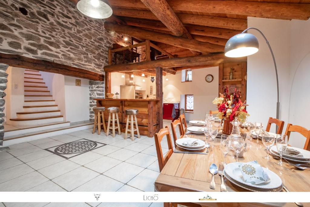 a large dining room with a table and chairs at Chalet Alpin in Val Cenis