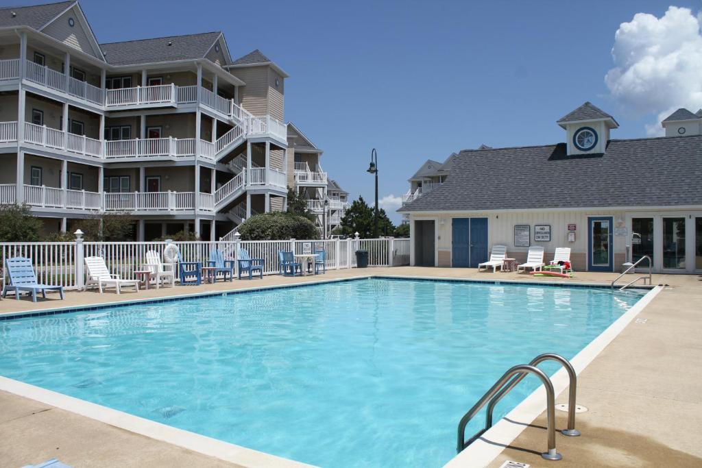 a large swimming pool in front of a building at Hwy 12 Slash Creek in Hatteras