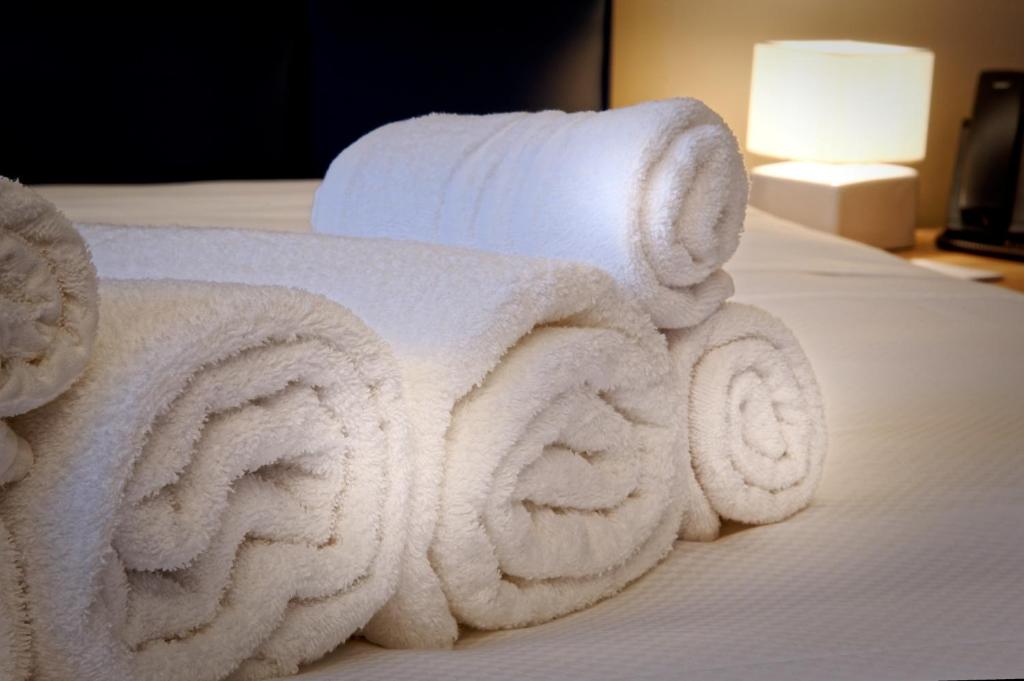 A bed or beds in a room at Albergo Giuan Arma di Taggia