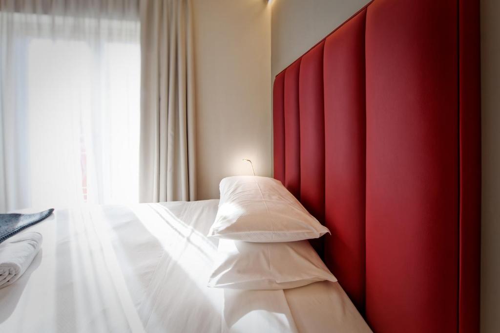 A bed or beds in a room at Albergo Giuan Arma di Taggia