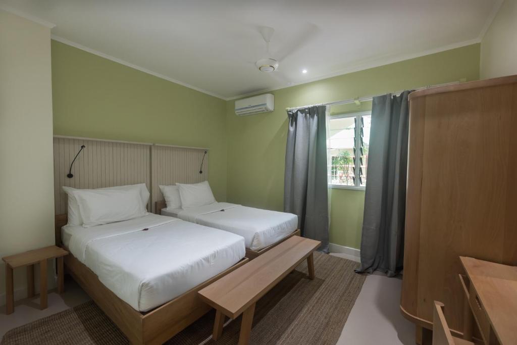 Postel nebo postele na pokoji v ubytování Residence Praslinoise