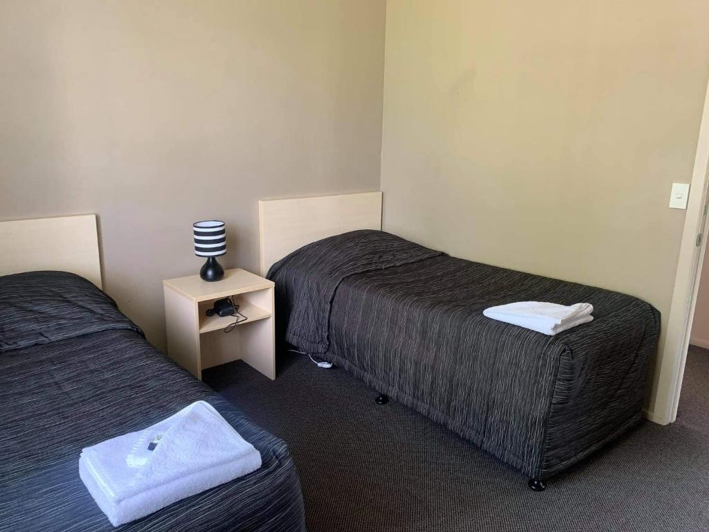 Postel nebo postele na pokoji v ubytování Catlins Inn