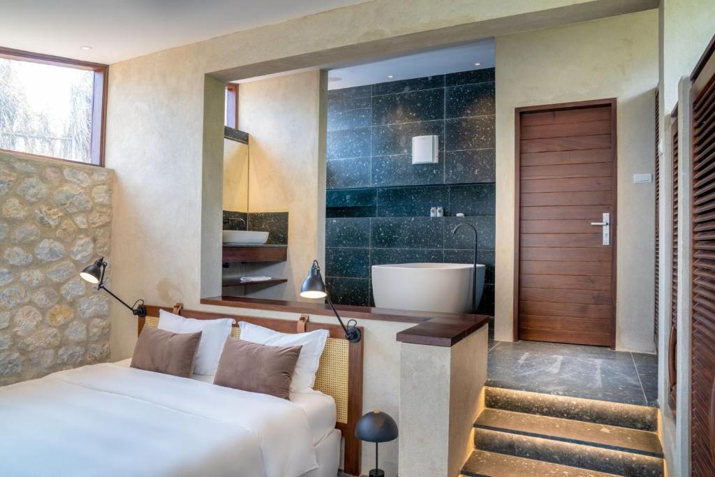 Postel nebo postele na pokoji v ubytování Topas Ecolodge