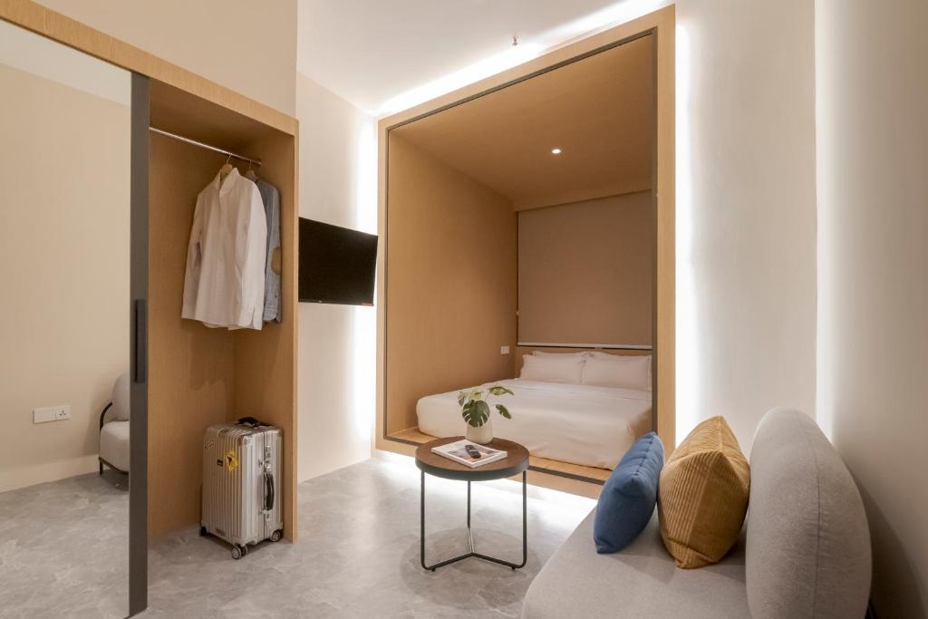 Postel nebo postele na pokoji v ubytování Harper Boutique Hotel at Sutera Avenue