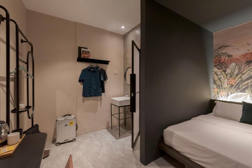 Postel nebo postele na pokoji v ubytování Harper Boutique Hotel at Sutera Avenue